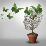 Le Complexe Corps-Mental Psychology help and solutions to psychiatric problems and mental health as a learning concept with an empty tree and leaves shaped as butterflies coming to support and fill the void.