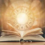 Un livre ouvert avec avènement des signes du zodiaque.